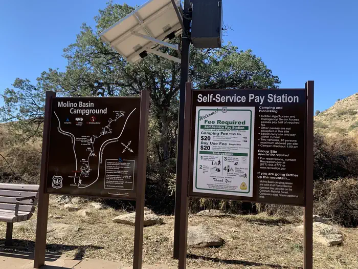 Molino — Entry signs with a map and pay information ($20 per night)