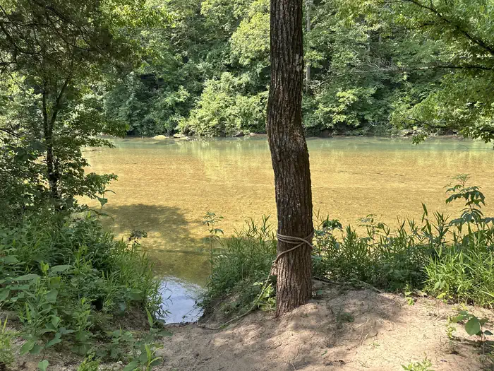 Akers — A group campsite next to the river with trees and shade