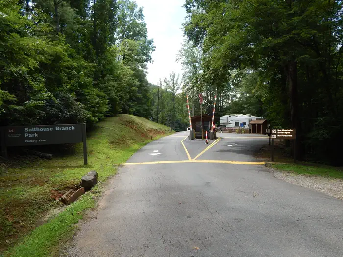 Salthouse Branch Campground — The entry gate and kiosk surrounded by forest as you enter the campground.