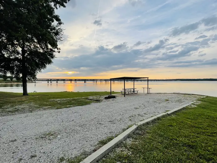 Juniper Point — A photo of facility JUNIPER POINT with Picnic Table, Electricity Hookup, Fire Pit, Waterfront, Water Hookup