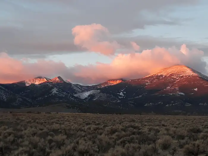Lower Lehman Creek Campground — Snowy mountain peaks glowing with sunrise colors