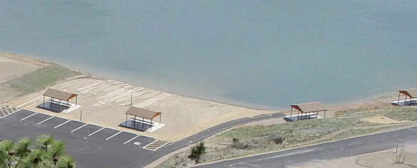 White Sandy Campground — Beach/swimming area at BLM White Sandy Campground. 2 shade structures within the sandy beach area and 2 shade structures adjacent to the swimming area. These 4 shade structures are for day-use only.