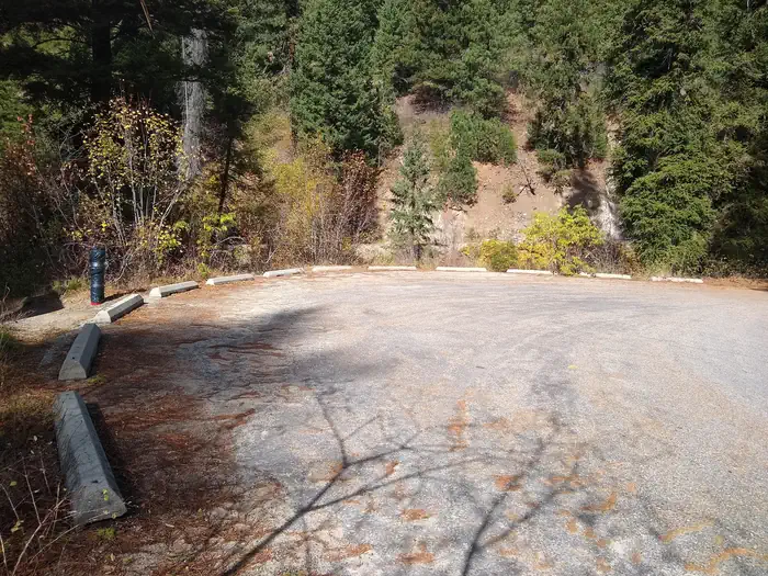 Hayfork Group Campground — A round paved parking lot surrounded by trees.