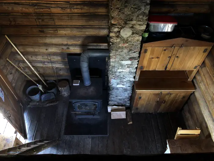 Little Bear Cabin — Wood stove and cabinet from the loft