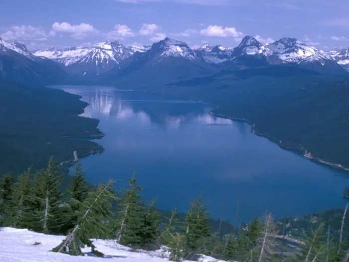 Sprague Creek Campground — Lake McDonald surrounded by snow covered peaks.