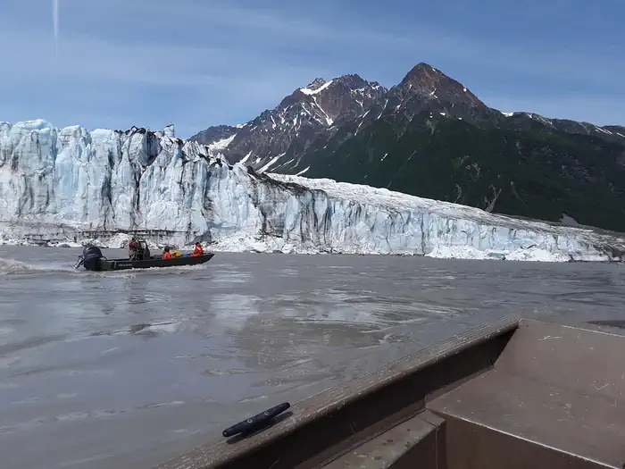 Childs Glacier Recreation Area — People in a boat in front of Childs Glacier