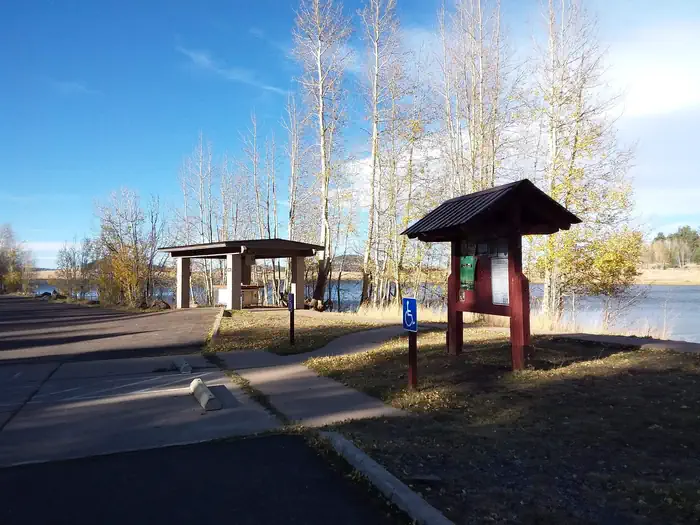 Grayling — Grayling Campground Information Kiosk with view of Big Lake