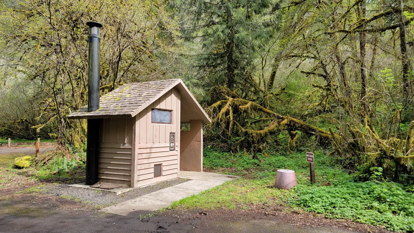Alder Glen Recreation Site — Alder Glen campground vault toilet near entrance