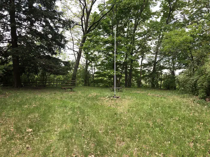Rivers Bend Group Campground — Benches and flag pole overlooking the river.