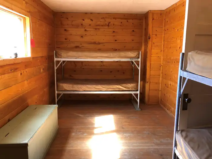 Podunk Guard Station — Bunkbeds and wooden storage box