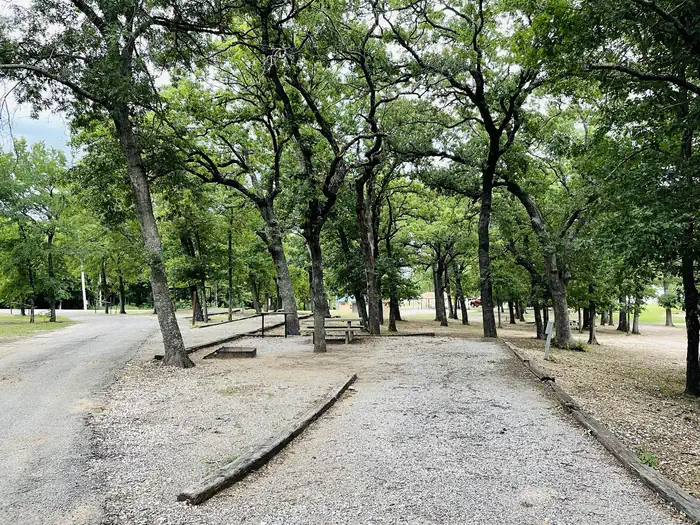 Caney Creek — A photo of facility CANEY CREEK with Picnic Table, Electricity Hookup, Fire Pit, Shade, Water Hookup