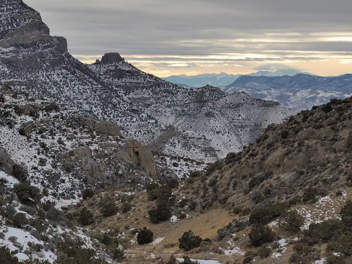 Wheeler Peak Campground — Canyon with a dusting of snow. Tall snowy peaks in the distance.