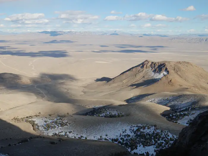 Wheeler Peak Campground — Long view of open desert with mountains and cloud shadows