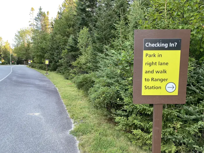 Seawall Campground — Camper check in sign stating- park in right lane and walk to ranger station