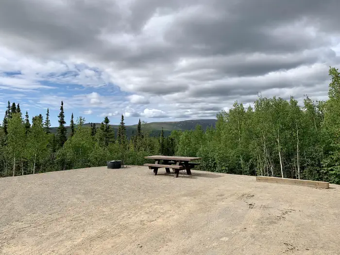 Arctic Circle Campground — Campsite with view of nearby hills