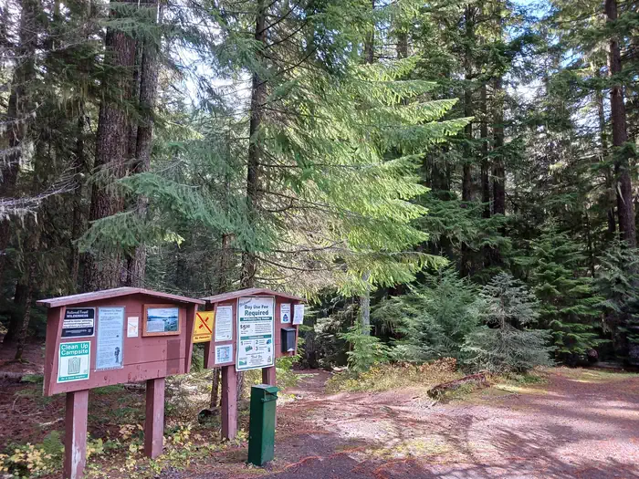 Skookum Creek Campground — Kiosk in a forest.