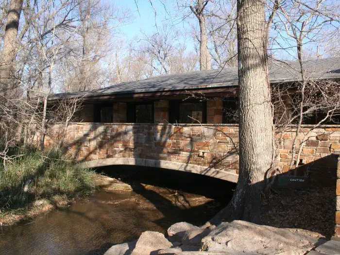 Cold Springs Campground — Travertine Creek flows under a stone bridge at the Travertine Nature Center