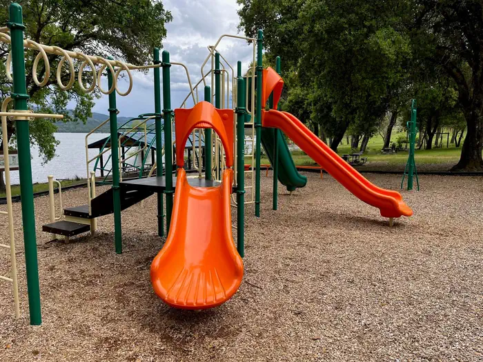Pomo Day Use Area — Playground with monkey bars, climbing structures, and 3 slides