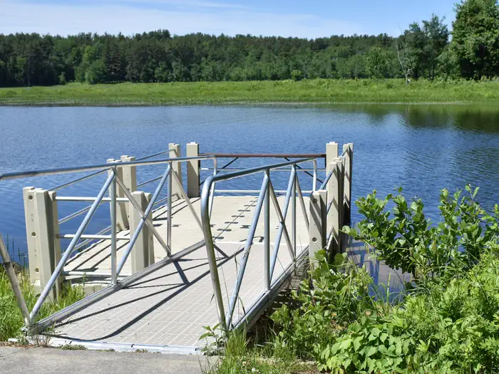 Elm Brook Park Rec Area — The Elm Brook Park fishing dock overlooking Hopkinton Lake on a sunny day.
