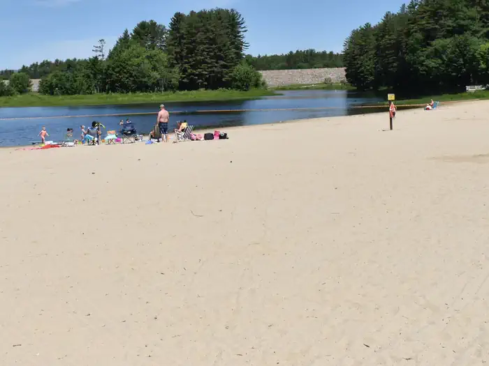 Elm Brook Park Rec Area — A group of visitors enjoying the Elm Brook Park beach on a clear summer day.