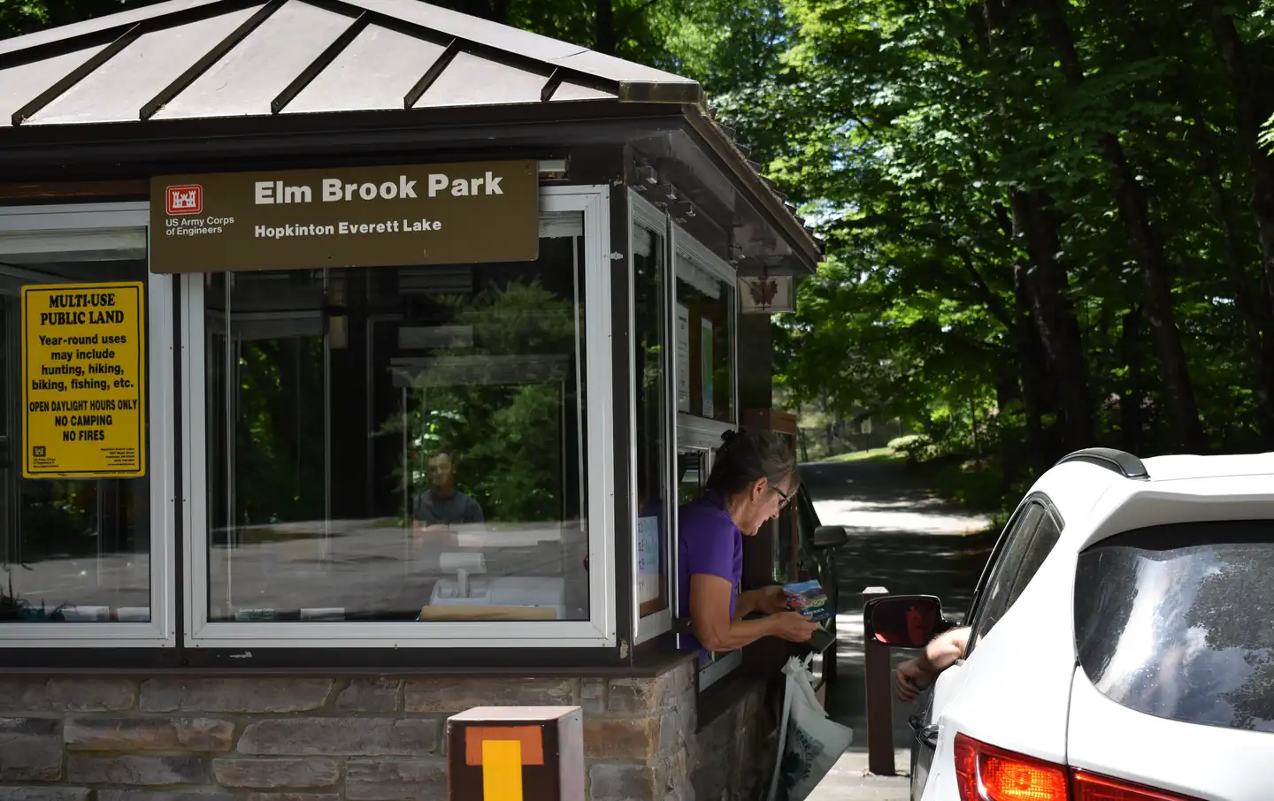Elm Brook Park Rec Area — A Park Host greeting a visitor in their vehicle at the Elm Brook Park Entrance Booth.