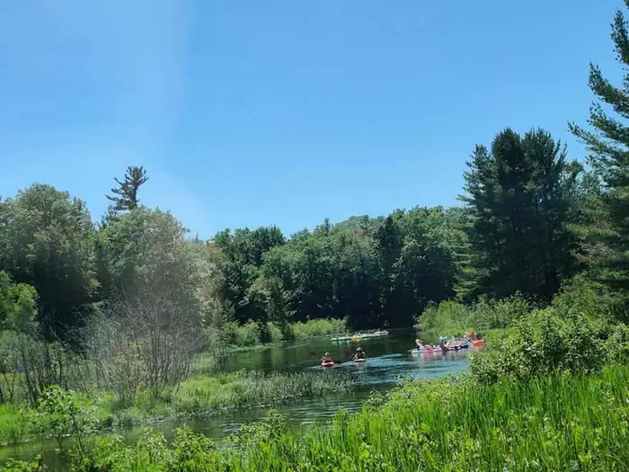 Platte River Campground — Group kayaking and inner tube floating on the Platte River
