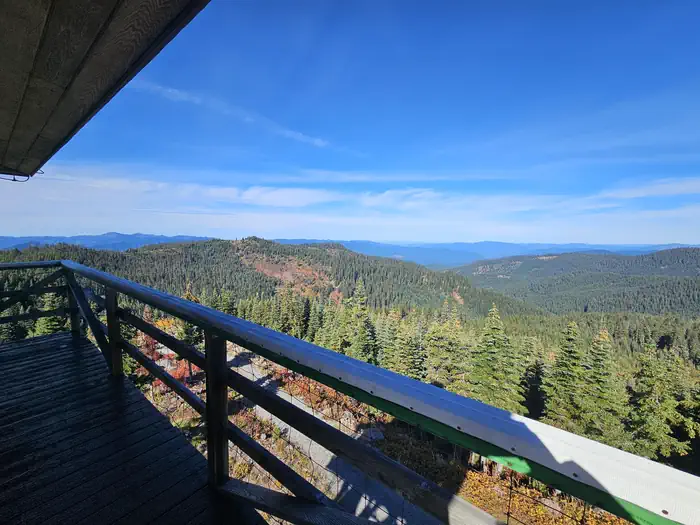 Warner Mountain Lookout β View from the Lookout with trees and hills and blue sky.