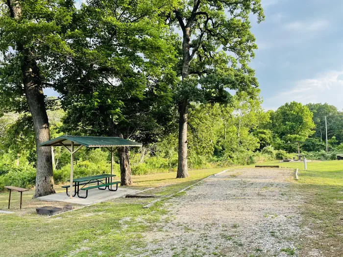 Buncombe Creek — A photo of facility BUNCOMBE CREEK with Picnic Table, Electricity Hookup, Fire Pit, Shade, Water Hookup
