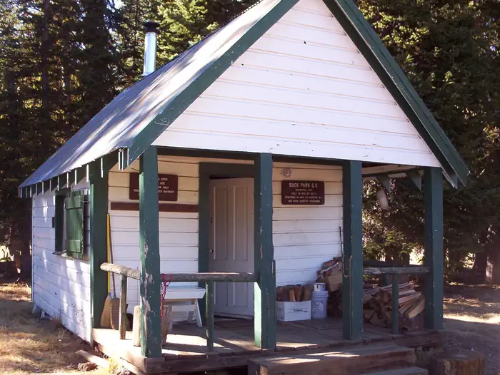 Buck Park Cabin β Front of white and green cabin