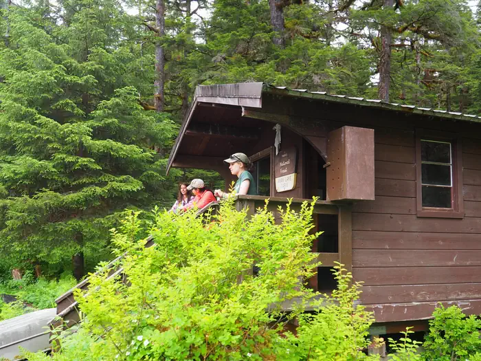 Anan Lake Cabin — Visitors on the porch of Anan Lake Cabin