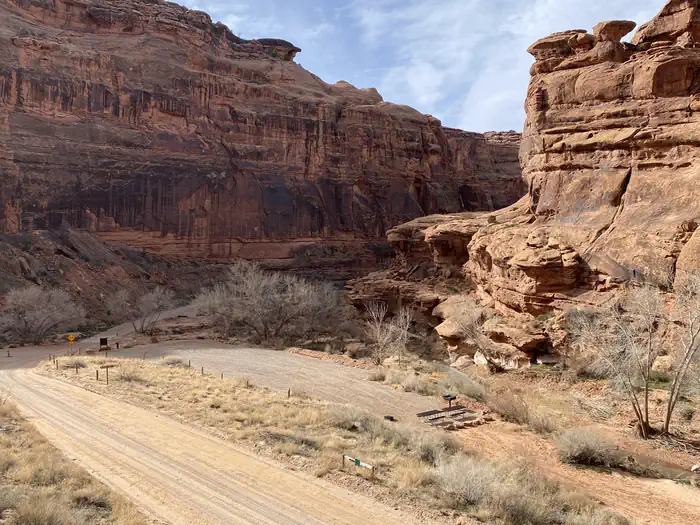 Hunter Canyon Campground — Overview of group campsite with cliffs in background.