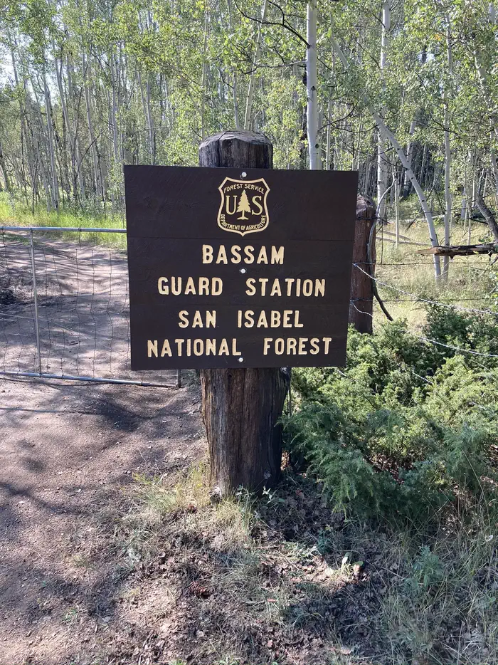 Bassam Guard Station — Wooden sign