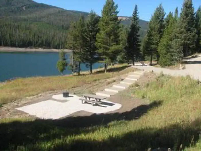 Hood Creek Campground — Hood Creek Campground steps down to campsite with view of Hyalite Reservoir