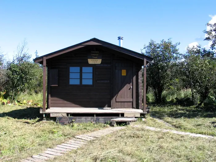Koknuk Cabin — Koknuk Cabin with wood trail in front