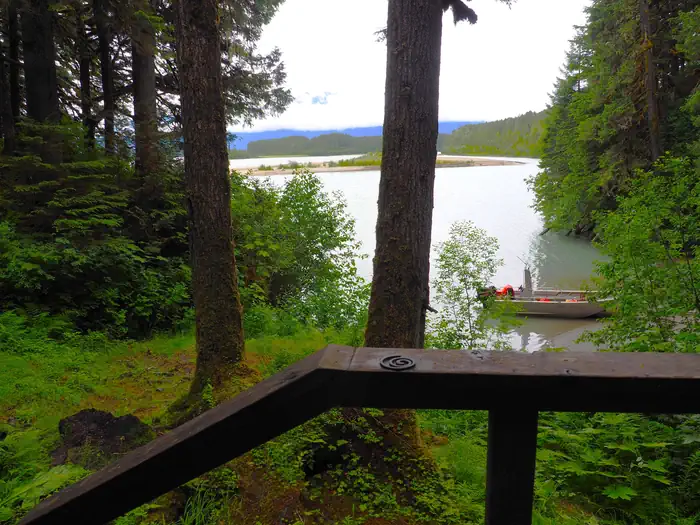 Mount Flemer Cabin — View from entrance of Mount Flemer Cabin showing trees, water and a small boat