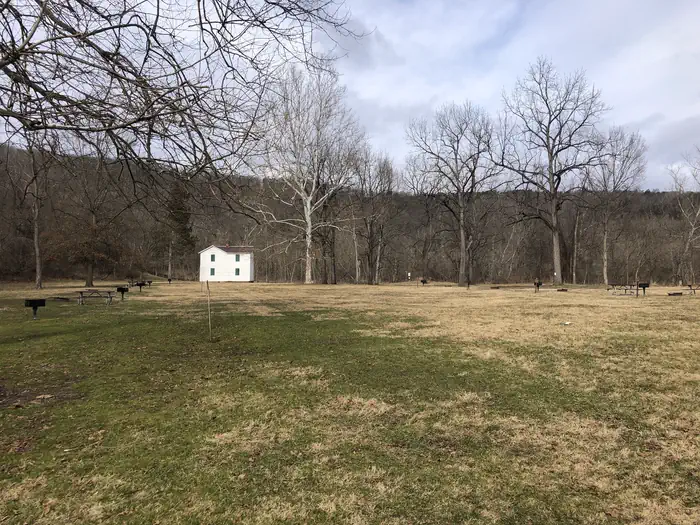 Paw Paw Tunnel Campsite — The grassy expanse of Paw Paw campground with the historic canal superintendent’s house