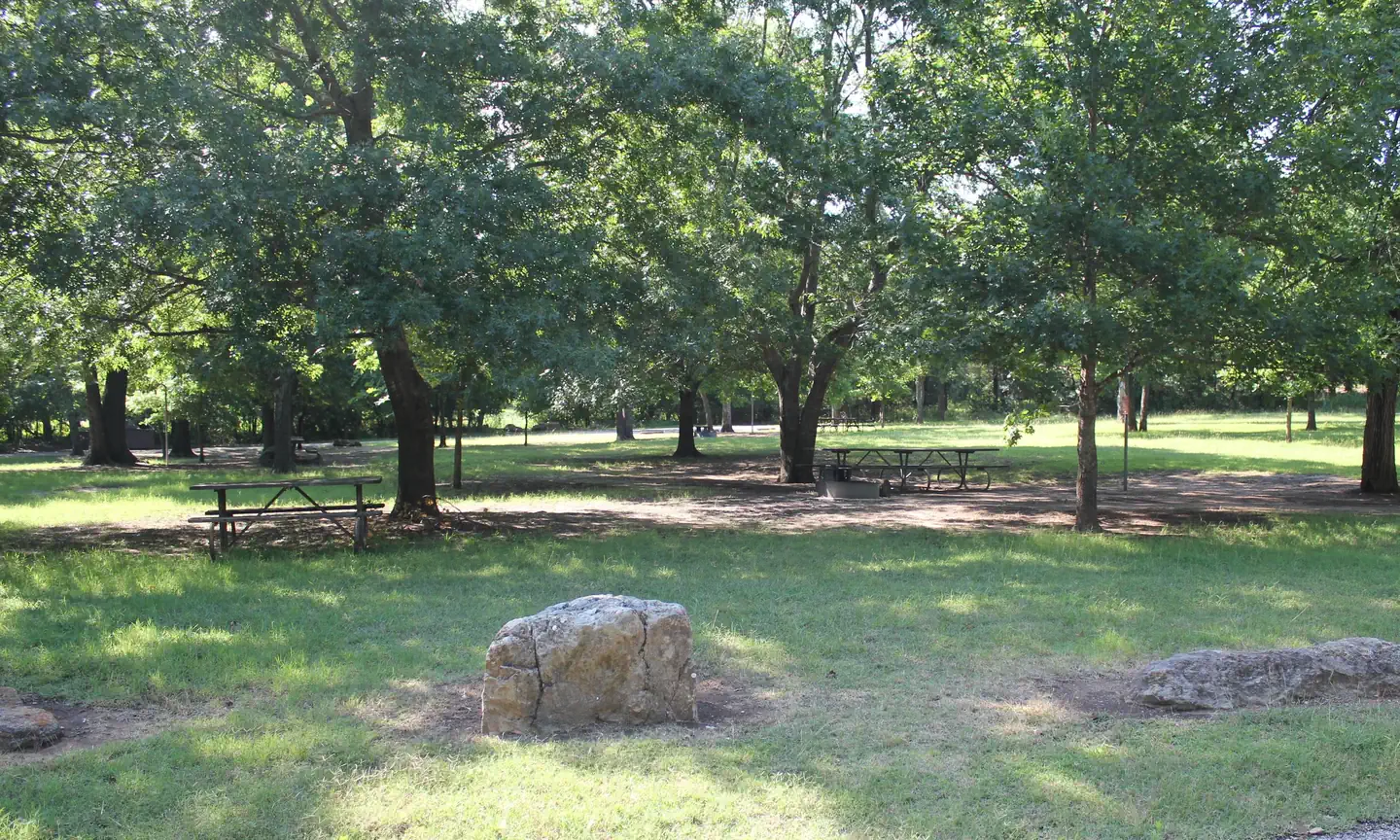Central Group Campground — Central Group Campground showing picnic table, rocks, trees and grass.