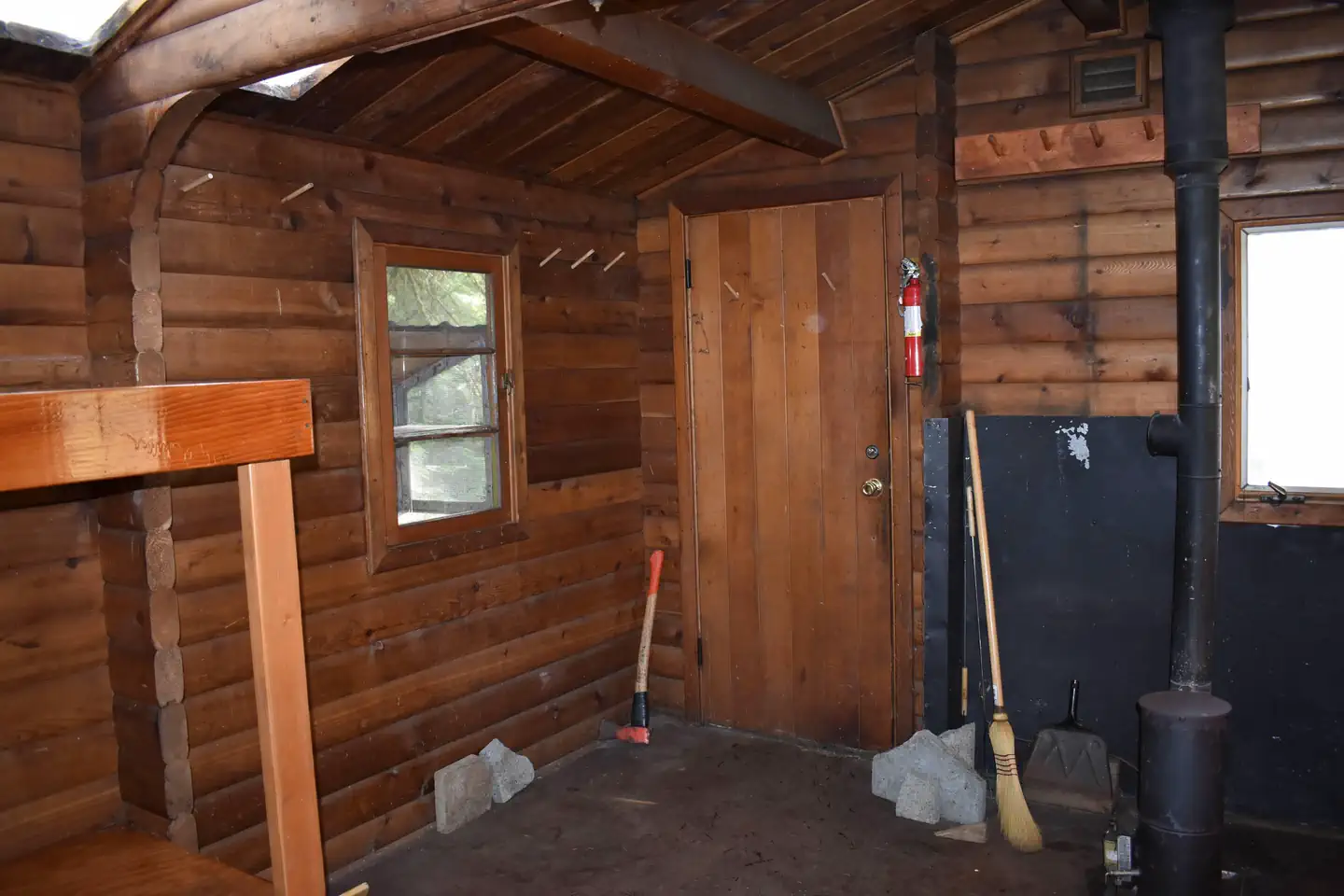 Humpback Lake Cabin — Entrance Area and Stove