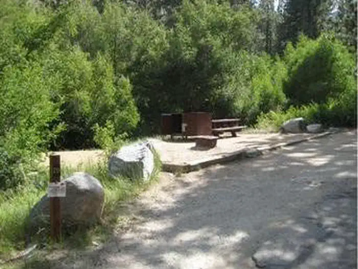 Big Pine Creek Campground — Large boulders frame a campsite in the forest