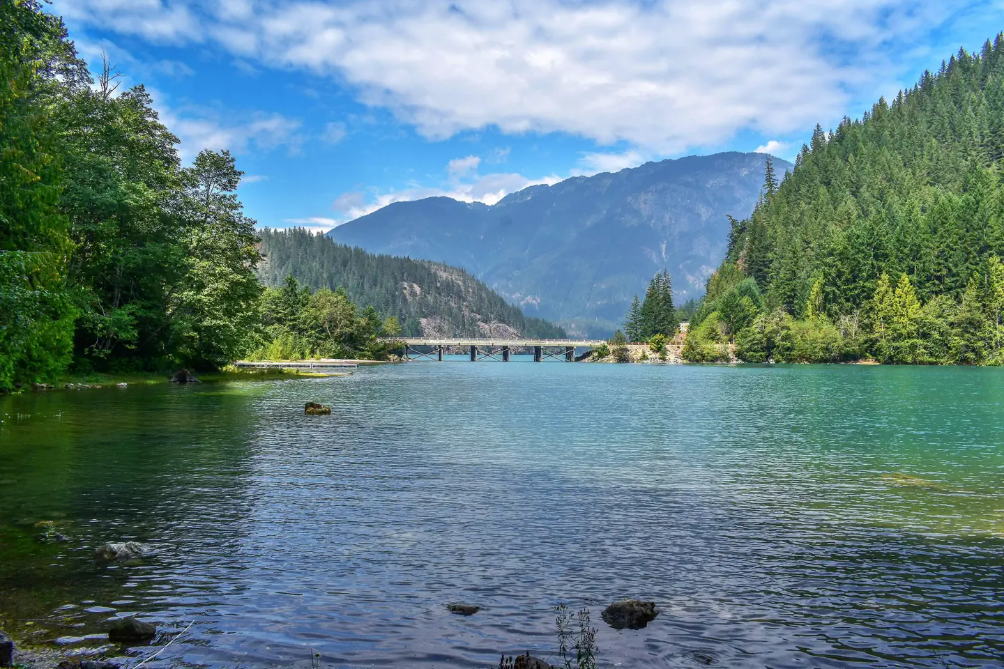 Colonial Creek South Campground — Diablo Lake with highway bridge and mountains in the distance