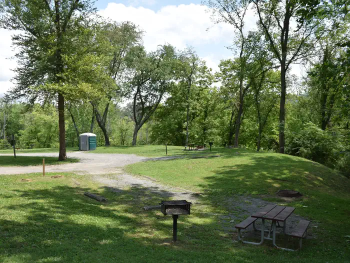 Fifteen Mile Creek Campsite — Single campsite with grill, picnic table and fire ring.