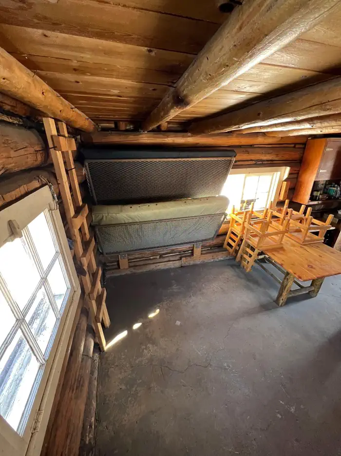 Hells Canyon Guard Station — Folding Bunk beds inside of a log cabin