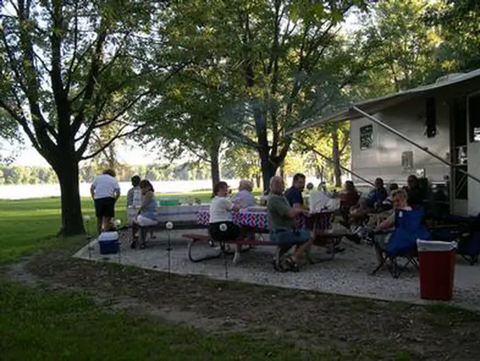 Shady Creek — Large Group of people at campsite picnic tables.