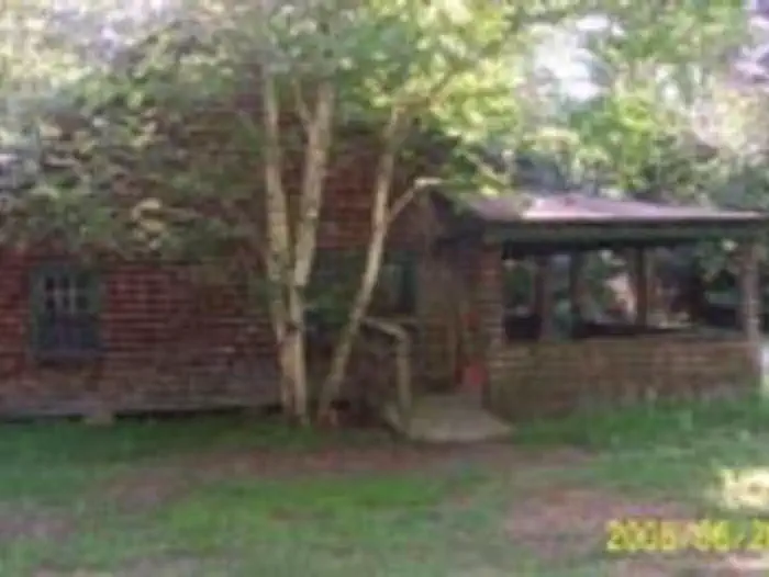 Radeke Cabin β Exterior of a wooden cabin with a large porch