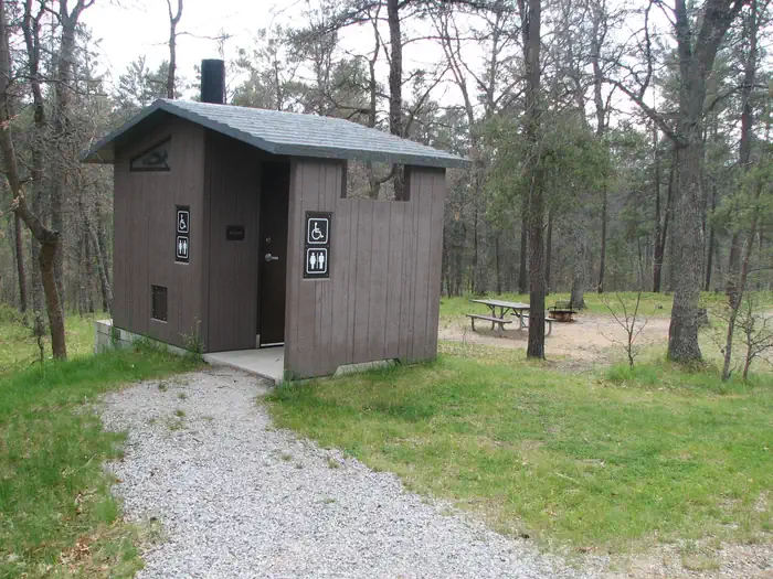 Kneff Lake Campground — A vault toilet in the Kneff Lake Campground
