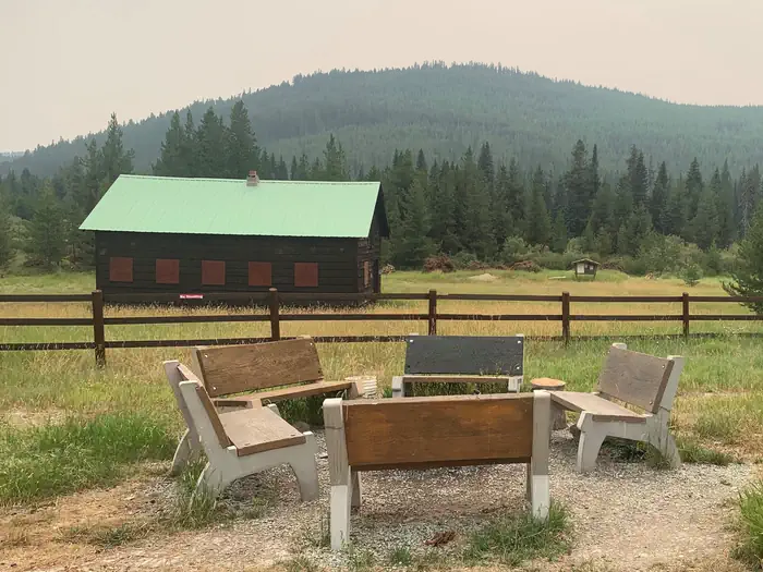 Star Meadows Guard Station — Five benches around a campfire