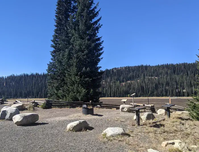 Grouse Campground — Goose Lake Boat Ramp day use area with fire pit, spotting scope and intepretive sign on the edge of the reservoir.