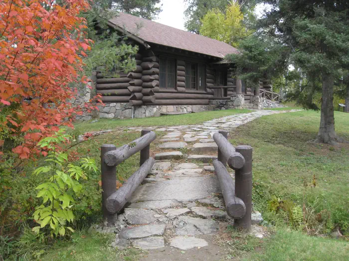 South Kawishiwi River — Picture of rock-lined path and log building.
