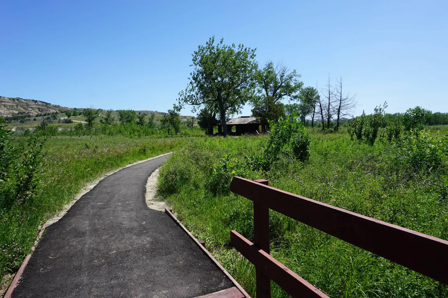 Juniper Campground Group Site — Bridge and blacktopped trail.