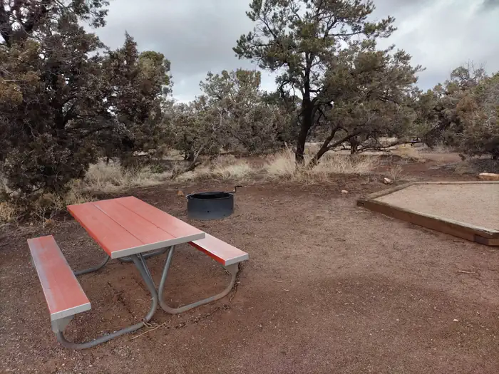 Natural Bridges Campground — Picnic table at a campsite in Natural Bridges